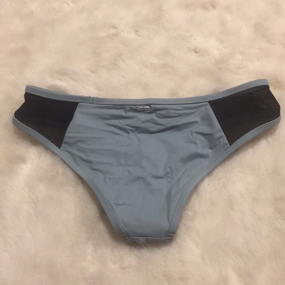 Pink bikini bottoms with sheer mesh sides